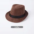 Macro shot of breathable linen coffee brown fedora hat with a black decorative ribbon - Coffee