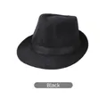 Close-up of black straw weave texture and ribbon detail on the men's fedora hat - Black