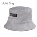 Detailed close-up of light gray cotton bucket hat stitching and UCLA woven label logo - One Size 58cm / Light Gray