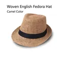 Detail of camel linen fedora hat featuring a classic black ribbon and breathable texture - Camel