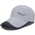 Detail of cotton baseball cap showing side HONGXING embroidery and brim stitching - Adjustable 57-59cm / White