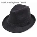 Close-up of black herringbone tweed wool fedora hat with premium textured woven fabric - 56cm / Black Herringbone