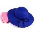 Detail of royal blue wool fedora hat featuring black ribbon and elegant pearl pendant - M (56-58cm) / Royal Blue