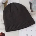 Deep gray winter knit beanie with ribbing and leather patch on magazine background - One Size (56-59cm) / Gray
