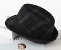 Close-up of vintage large black plaid gentleman hat with woolen texture on a magazine - One Size 58cm / Large Black Plaid