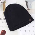 Navy blue winter knitted beanie for men with jacquard pattern and leather logo patch - One Size (56-59cm) / Blue