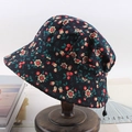Foldable navy floral bucket hat with adjustable drawstring on a wooden stand - One Size 58cm / Blue Cherry Flowers