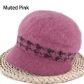 Close-up of dusty pink knit winter hat featuring a fuzzy texture and dark pattern band - Houndstooth Pink