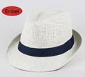 Dettaglio del cappello di paglia bianco panna con nastro decorativo blu scuro - Taglia unica / Bianco Latte