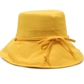 Detail view of a yellow canvas bucket hat with a decorative matching bow on the side - Adjustable 57-58cm / Yellow