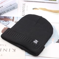 Men's black knit beanie with star sports tag on minimalist magazine background - One Size / High Elasticity / Solid Black (SPORT Label)
