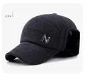Detail view of winter baseball cap with gray wool fabric and plush earflaps - Gray