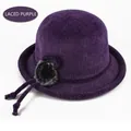 Detail of purple knitted bucket hat featuring a plush fur ball and elegant lace-up bow - Elastic 57-58cm / Lace-up Purple