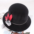 Detail of black faux fur winter hat with red rabbit ear decor and soft pompom - Medium (57-58cm) / Black with Fur Ball and Three Leaves