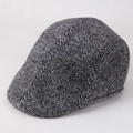 Detail of grey herringbone flat cap showing thick textured fabric for autumn and winter - One Size 57-58cm / Herringbone Light Grey