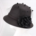 Detail of vintage wool felt cloche hat with floral mesh veil on white mannequin - One Size / Black With Mesh Flower
