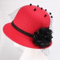 Detail of red wool felt cloche hat with black mesh veil and large fabric flower ornament - One Size / Bright Red With Mesh Flower