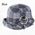 Detail of blue plaid winter hat showing thick wool texture and pom-pom decoration - Adjustable 57-58cm / Blue