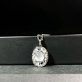 Macro shot of oval moonstone pendant with sparkling pavé diamonds on a silver chain - Translucent White (XL266-T)
