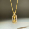 Detailed macro of 18K gold-plated Vajra pendant with sparkling zircon stones - Oval Vajra Pendant (XL311-T)