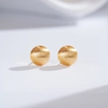Macro detail of brushed 24K gold plated ball earrings with matte metallic texture finish - Round (ED213-T)