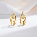 Detail of 24K gold earrings featuring double oval layers and brushed metal texture - Oval (ED216-T)