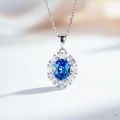 Detailed close-up of a flower-shaped silver necklace with a large oval blue gemstone - With Chain / Blue Diamond (XL044)