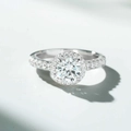 Macro shot of 1 carat round halo moissanite ring with pavé diamond setting in white gold - US 5 / D Color High Carbon Diamond Style (CBJZ344)