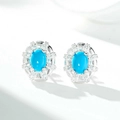 Close-up of S925 silver oval turquoise stud earrings with halo diamond settings - Stud Earrings (ED239)