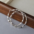 Orecchini a cerchio in argento irregolari e brillanti con design sfaccettato in stile moderno - Argento