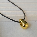 Polished gold water drop pendant necklace on a black leather cord with minimalist design - Gold