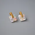 Macro detail of square mosaic mother of pearl earrings with brushed gold finish hooks - Colorful