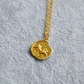 Vintage gold coin pendant necklace featuring an embossed portrait on a delicate chain - Virgo