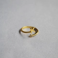 Macro detail of gold adjustable ring featuring a letter K charm and a sparkling zircon stone - Alphabet Style K