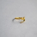 Macro shot of an adjustable gold letter M ring featuring a sparkling zircon stone - Alphabet Style M
