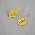 Detailed macro view of vintage gold leaf earrings with a hammered matte texture finish - Hammered Leaf (Style 1)