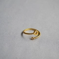 Detailed top view of an adjustable gold letter Q ring with a sparkling round zircon - Alphabet Style Q