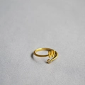 Macro view of adjustable gold ring with letter W charm and sparkling white zircon stone - Alphabet Style W