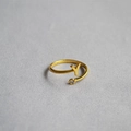 Macro shot of gold-tone initial Y open ring featuring a sparkling round gemstone - Alphabet Style Y