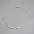 Minimalist gold chain necklace featuring natural freshwater pearls with lobster clasp closure - Gold Smiley Face Pearl Necklace
