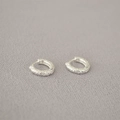 Minimalist silver hoop earrings with hammered texture and rustic lava finish - Silver