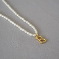 Elegant freshwater rice pearl necklace with a gold bamboo textured letter B pendant - Letter B