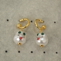 Detail of baroque pearl earrings with hand-painted red smile and green gem eyes - Smiley Face Print