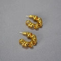 Detailed view of gold twisted spiral earrings featuring a C-shape textured design - Gold Spiral Twisted C-Shape Minimalist Earrings (27)