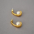 Retro matte gold hook earrings with pearls and 925 silver needles on grey texture - Gold