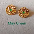 Detailed macro view of May birthstone stud earrings with green gems and gold hammered texture - 1.5cm-May Green
