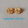 Detail of gold hammer-textured stud earrings with September teal green gemstone centers - 1.5cm-September Lake Blue