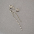 Detailed view of silver asymmetric long chain tassel earrings with textured square accents - White Gold
