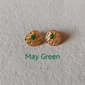 Macro detail of gold textured earring with green gemstone inlay for May birthstone - 1cm-May Green
