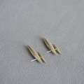 Minimalist silver rivet earrings with sleek conical design on dark textured background - Platinum Plated